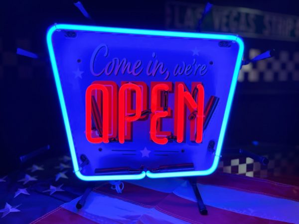 open neon sign (come in we're open)
