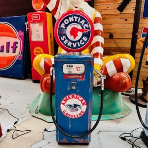 Pontiac services American gas pump with original patina.